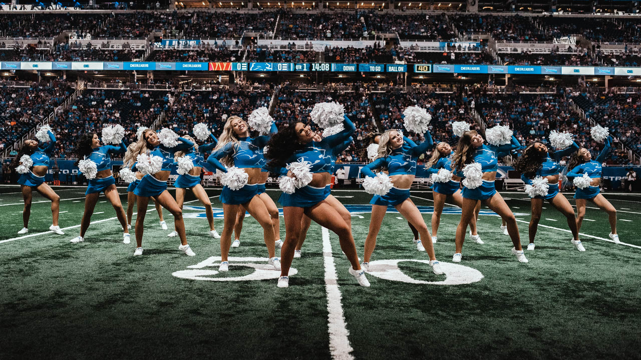 A member of the Washington Commanders cheerleaders performing on