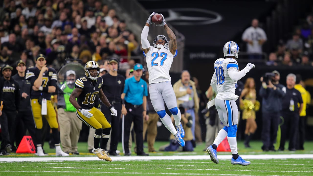 Detroit Lions running back Billy Sims (20) leaps over New Orleans Saints  tacklers in the fourth quarter on, Oct. 12, 1980 in Pontiac, Minnesota.  Simms scored on the play, and Detroit defeated