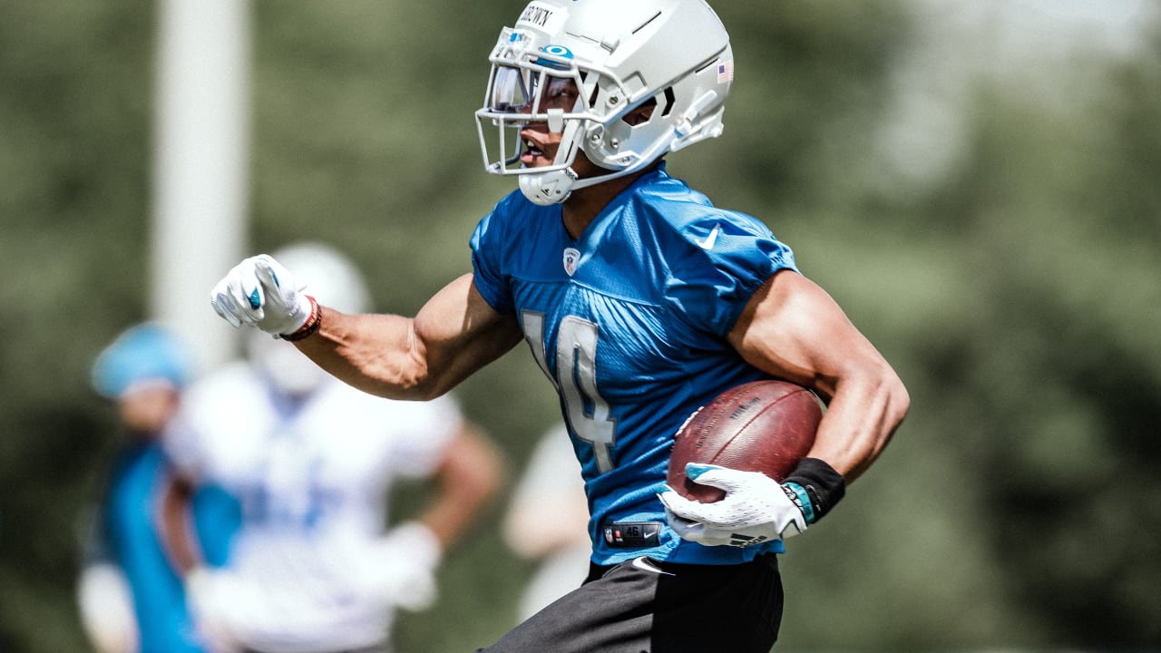 Detroit Lions wide receiver Amon-Ra St. Brown (14) runs a route