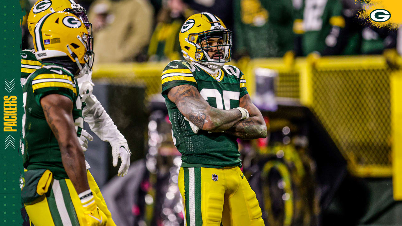 Green Bay Packers safety Dallin Leavitt (6) celebrates with teammates after  making an interception during a