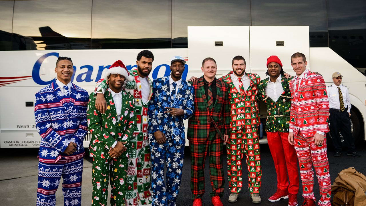 Packers wear Christmas suits to North Carolina