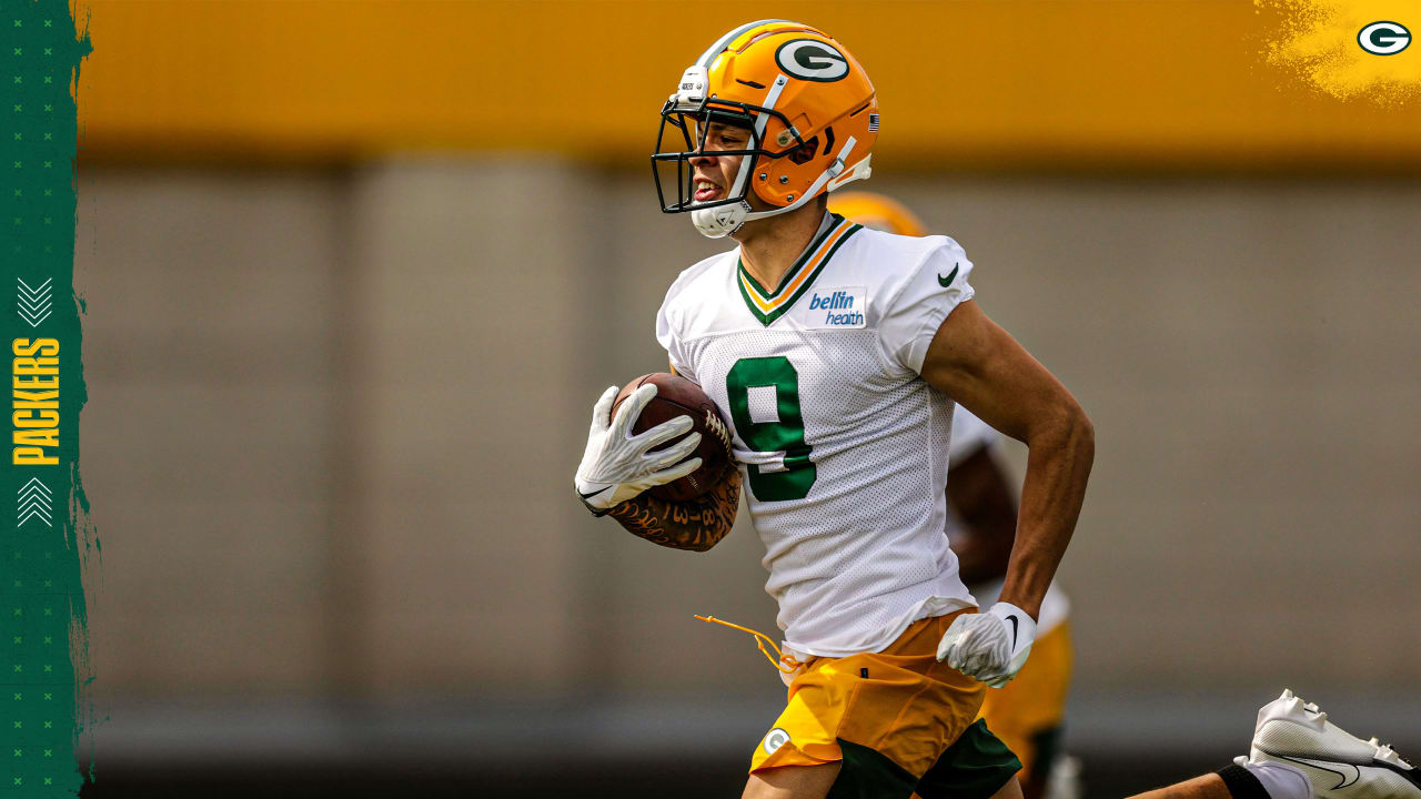 Green Bay Packers' Christian Watson practices before the first