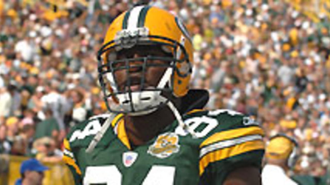 Green Bay Packers defensive end Kabeer Gbaja-Biamila wipes sweat away  during an Organized Team Activity (OTA) football session, Wednesday, May  31, 2006, in Green Bay, Wis. The Packers will continue to run