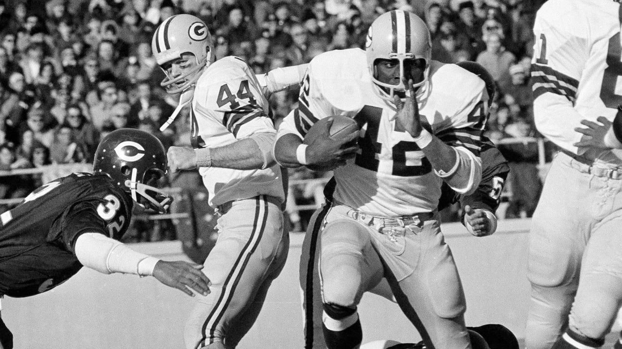 Green Bay Packers running back John Brockington (42) is brought