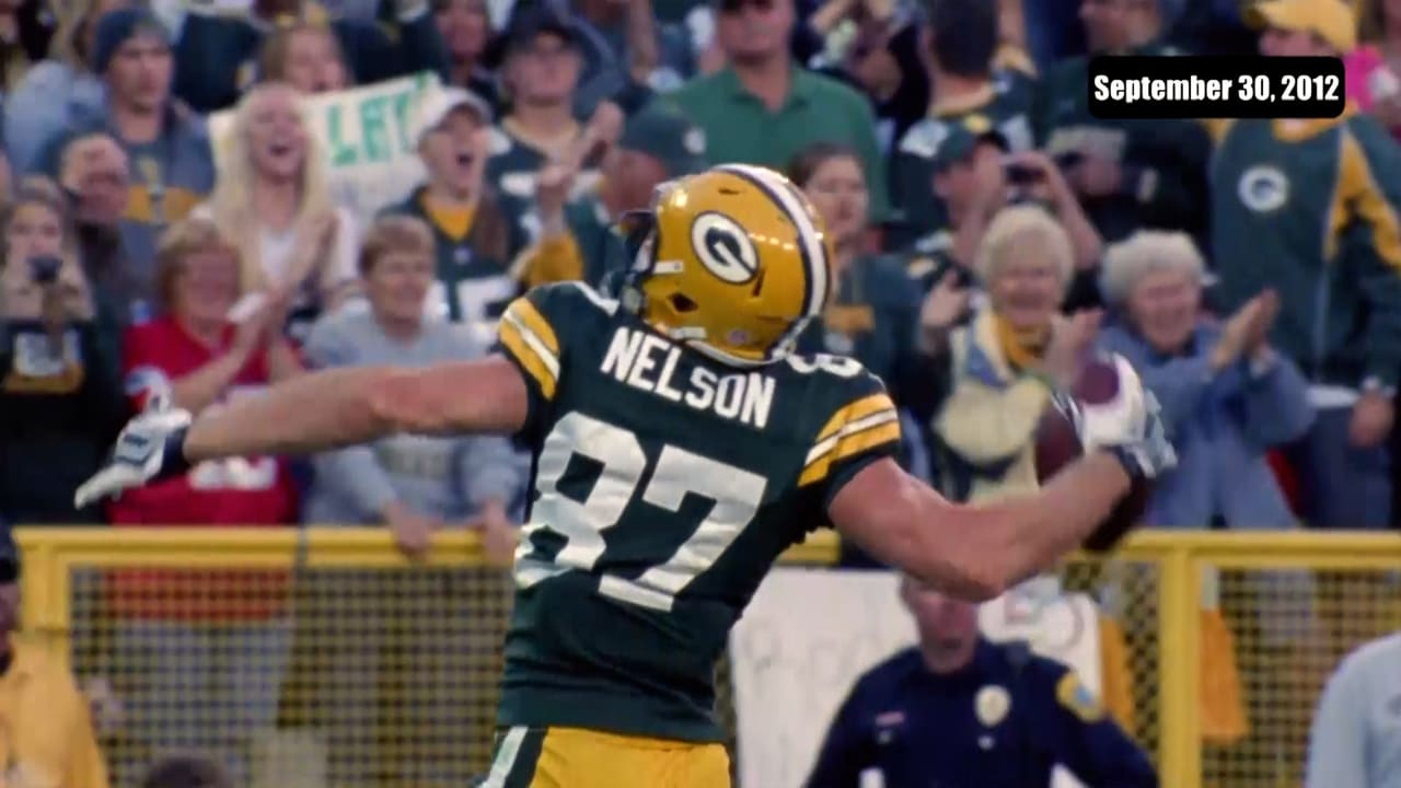 30 November 2008: Green Bay Packers quarterback Aaron Rodgers (12) hands  off the football in the first quarter at Lambeau Field in Green Bay,  Wisconsin. The Panthers defeated the Packers 35-31. (Icon