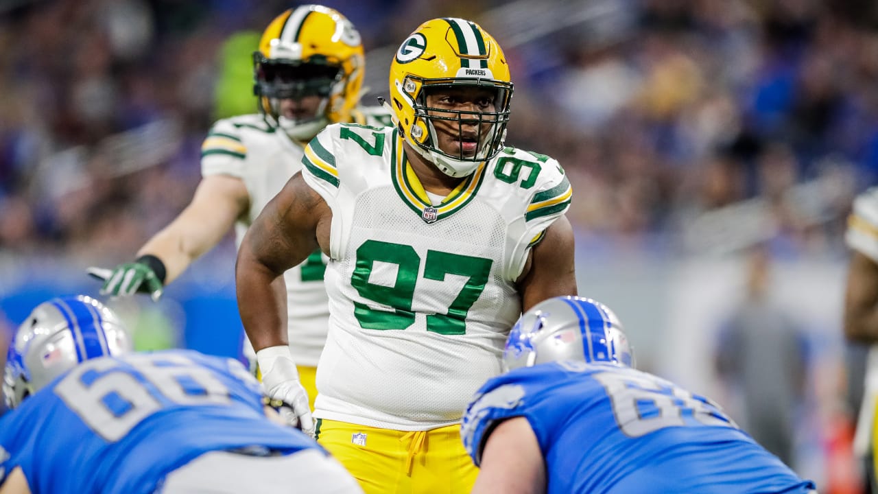 Green Bay Packers nose tackle Kenny Clark, left, exchanges jerseys