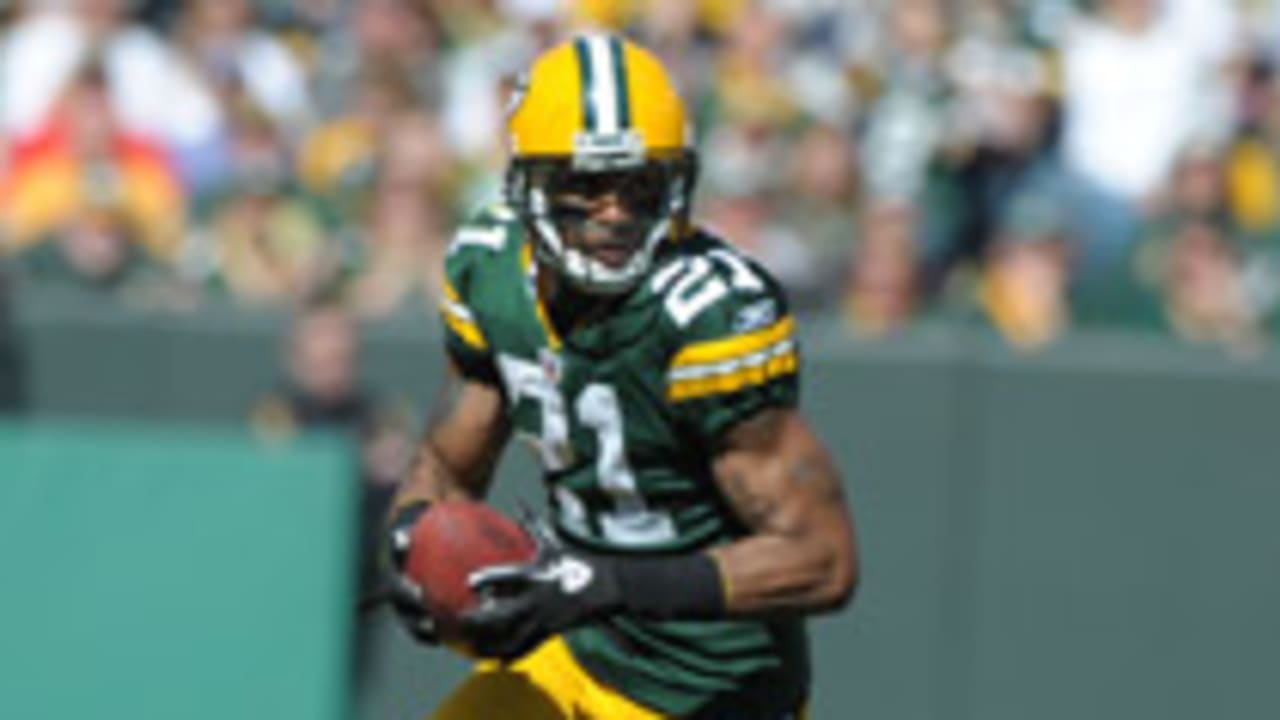 Photo: Green Bay Packers Charles Woodson breaks up a pass intended