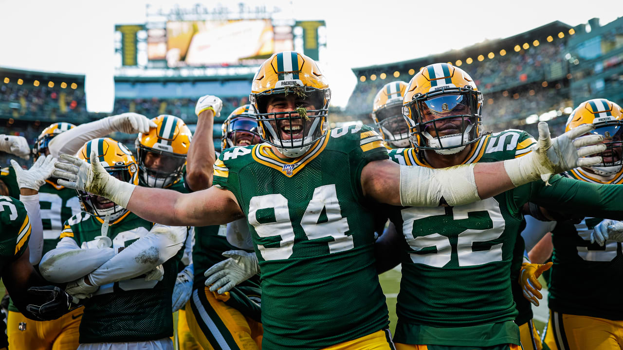 Green Bay Packers Helmet Is Shown On A Dark Background, Pictures