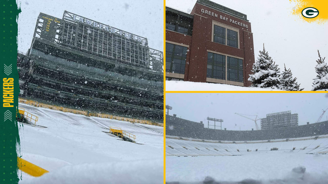Photos Springtime snowfall shrouds Lambeau Field