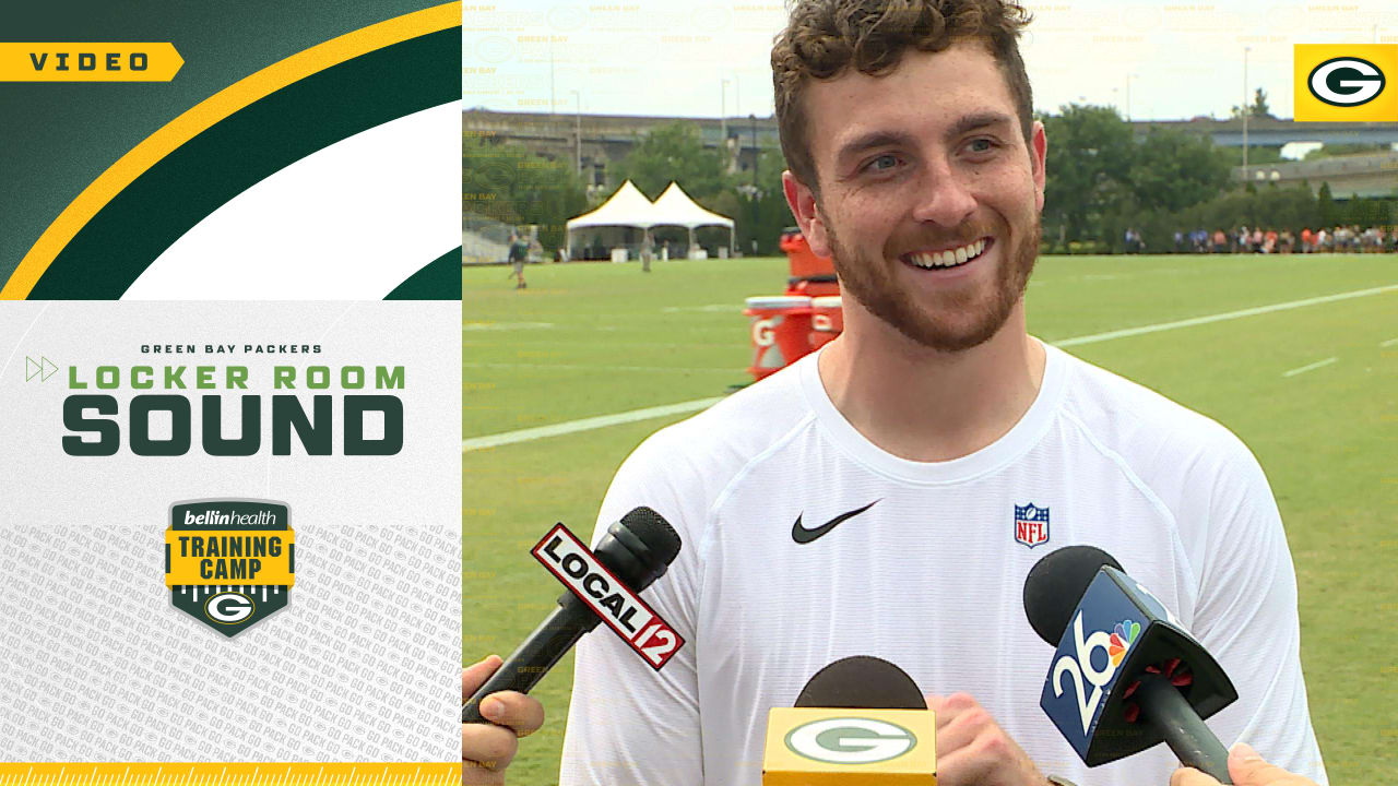 Sean Clifford shows off his brand new official Green Bay Packers