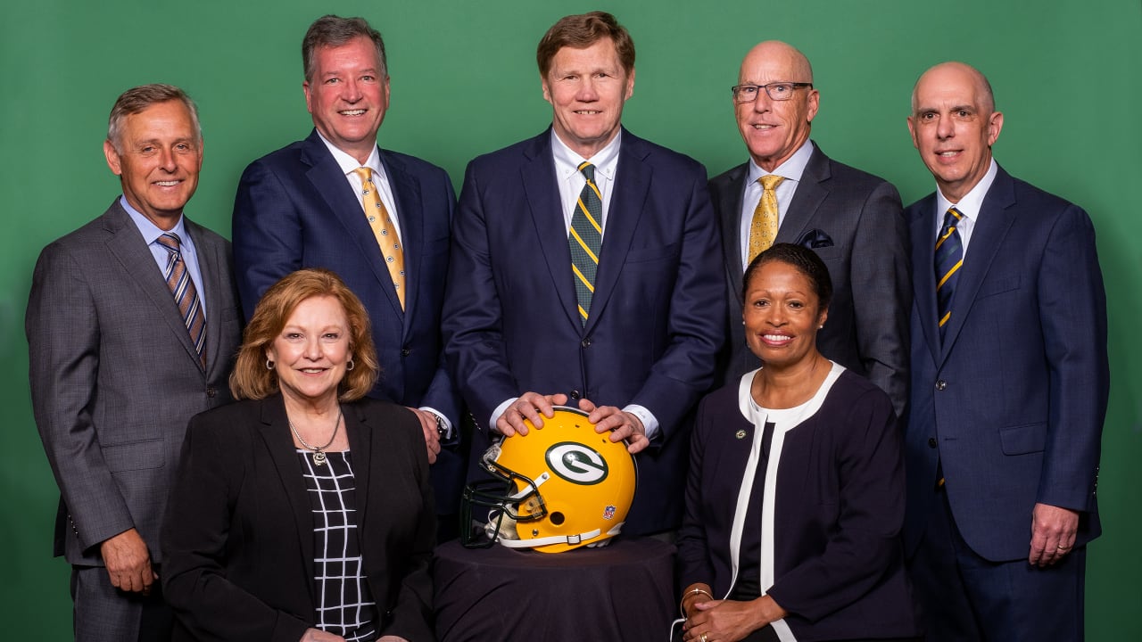 Green Bay Packers' fans who became owners stand with team