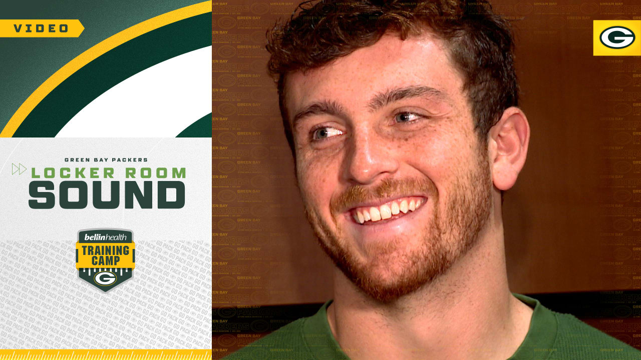 Sean Clifford shows off his brand new official Green Bay Packers