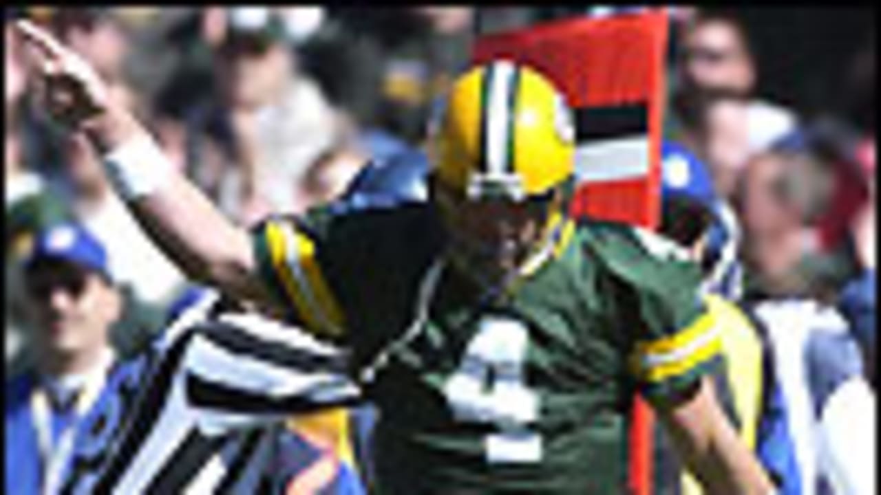 Green Bay Packers quarterback Brett Favre throws the football to the  sidelines after throwing a complete pass in the fourth quarter against the  St. Louis Rams, eclipsing Dan Marino to become the