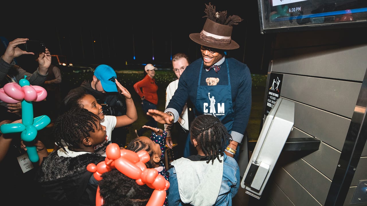 Cam Newton holds annual 'Thanksgiving Jam' for 1,200 children and their  families 