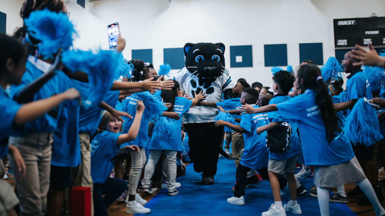 Students cheer reading at Carolina Panthers rally