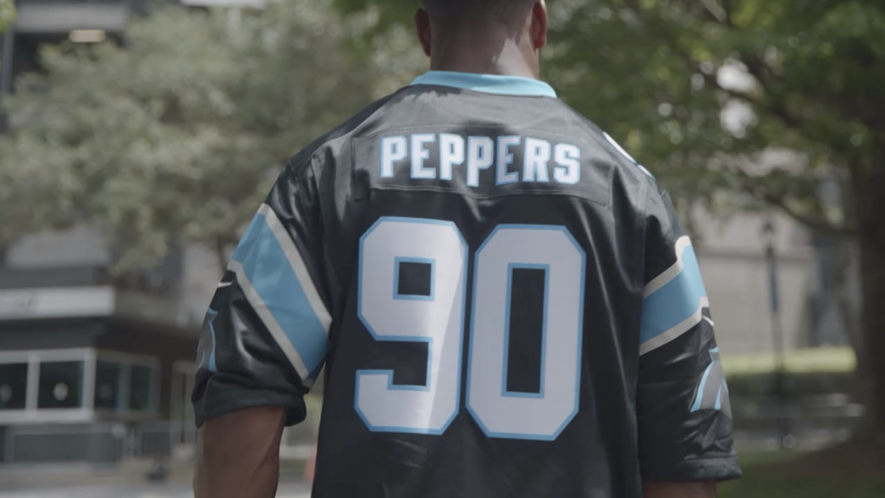 Jeremy Chinn arrives in Julius Peppers jersey