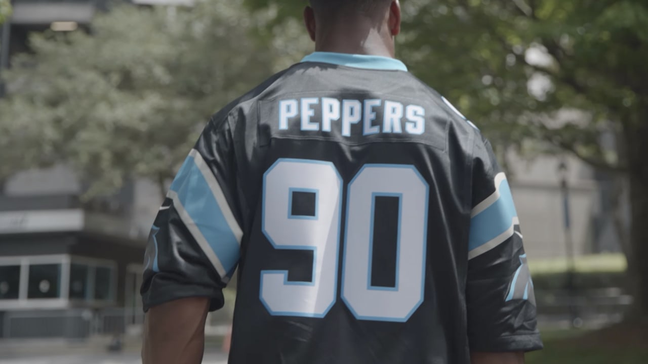 Panthers S Jeremy Chinn reps with Julius Peppers jersey