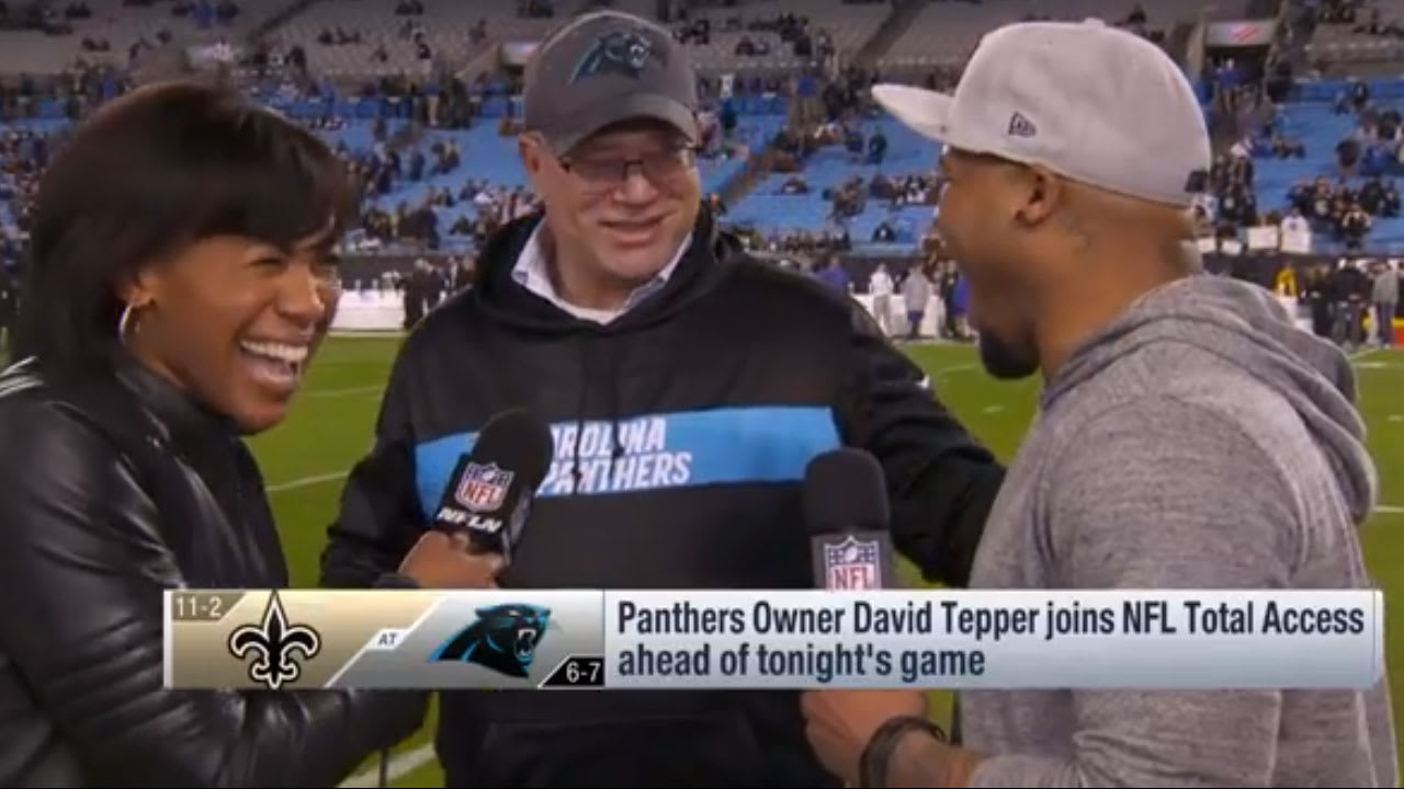 Carolina Panthers owner David Tepper, right, talks with Thomas