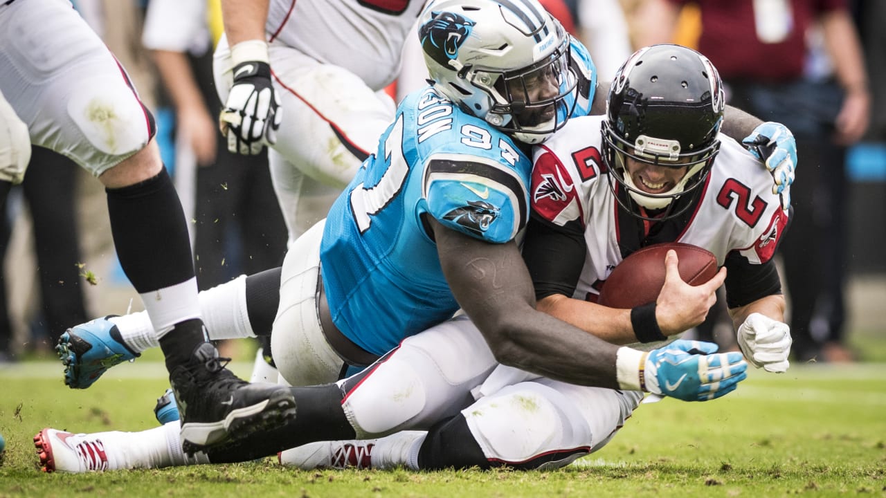 Carolina Panthers defensive end Mario Addison, left, and defensive