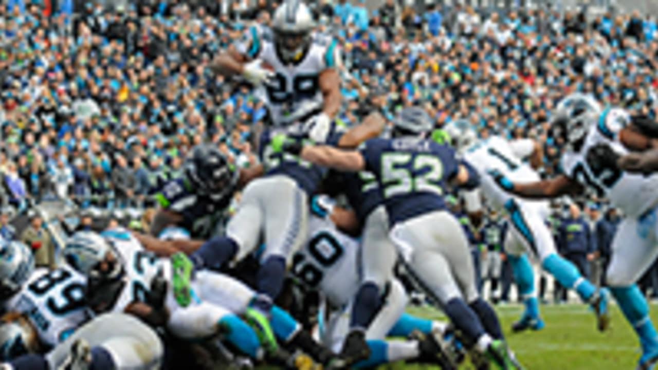 Carolina Panthers safety Tre Boston tackles Seattle Seahawks wide receiver  Tyler Lockett for a loss of yards in the first quarter of a NFC divisional  playoff football game at Bank of America