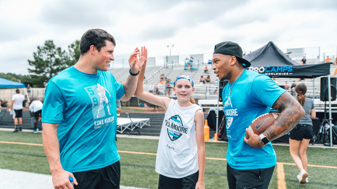 Luke Kuechly helps out at DJ Moore's youth football camp