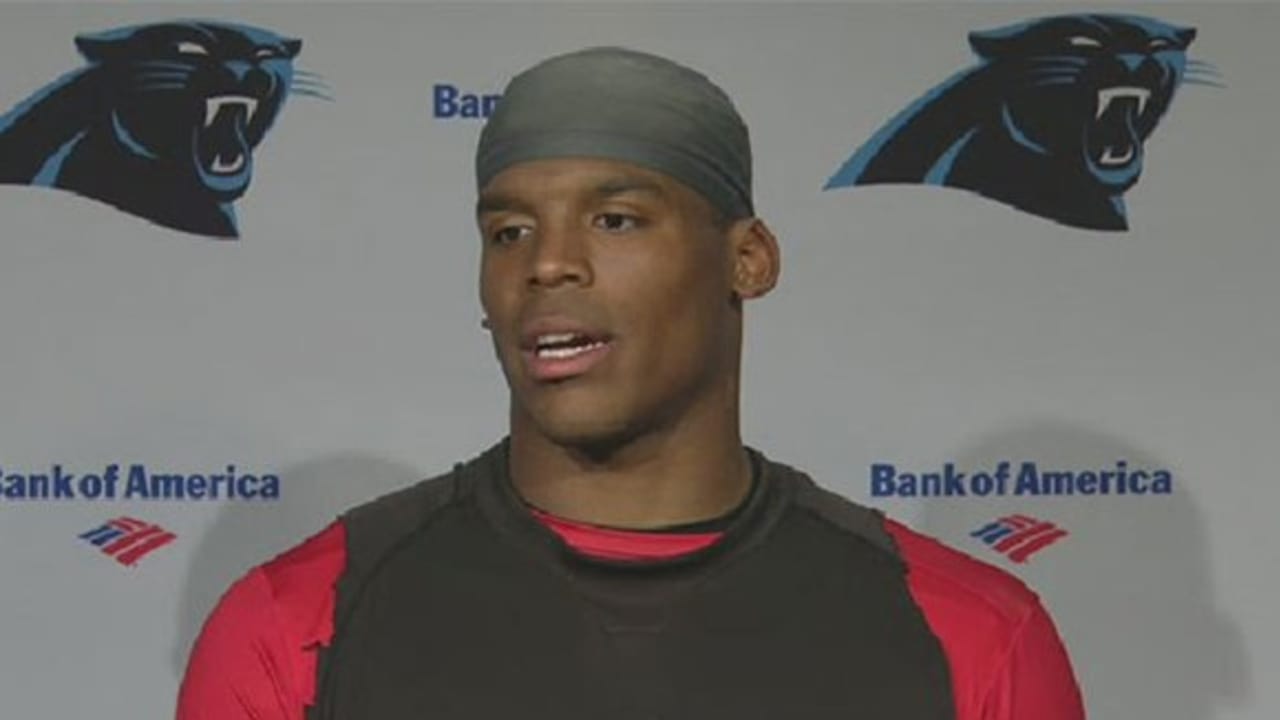 Does Cam Newton not wear a mouth guard? And does he chew gum while