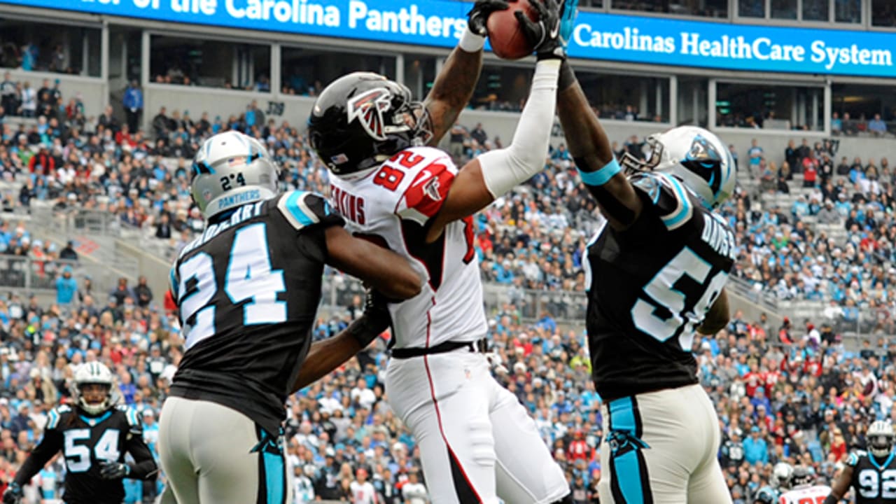 Carolina Panthers' Greg Olsen (88) celebrates with Cam Newton (1) after  Olsen passed 1,000 yards receiving in the first half of an NFL football  game against the Atlanta Falcons in Charlotte, N.C., …