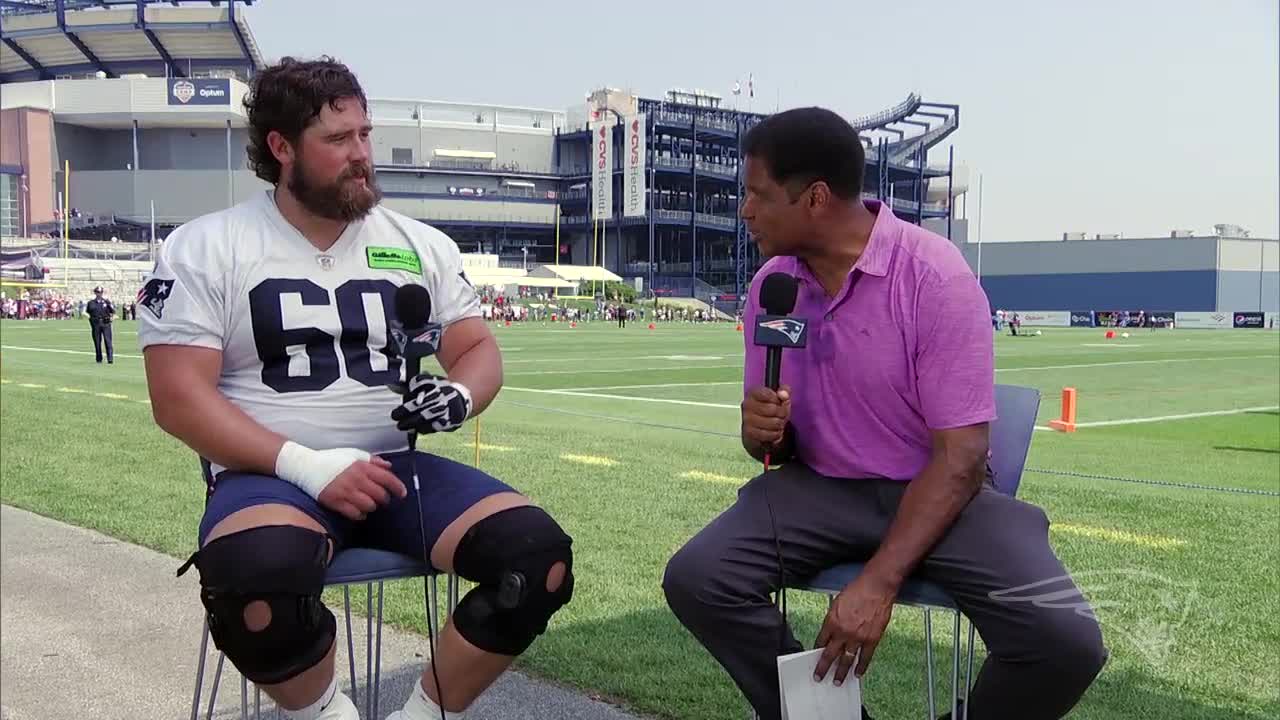 New England Patriots center David Andrews speaks with reporters