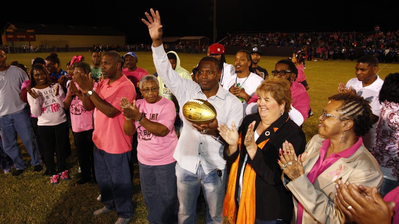 Troy Brown Presents Golden Football to BlackvilleHilda High School