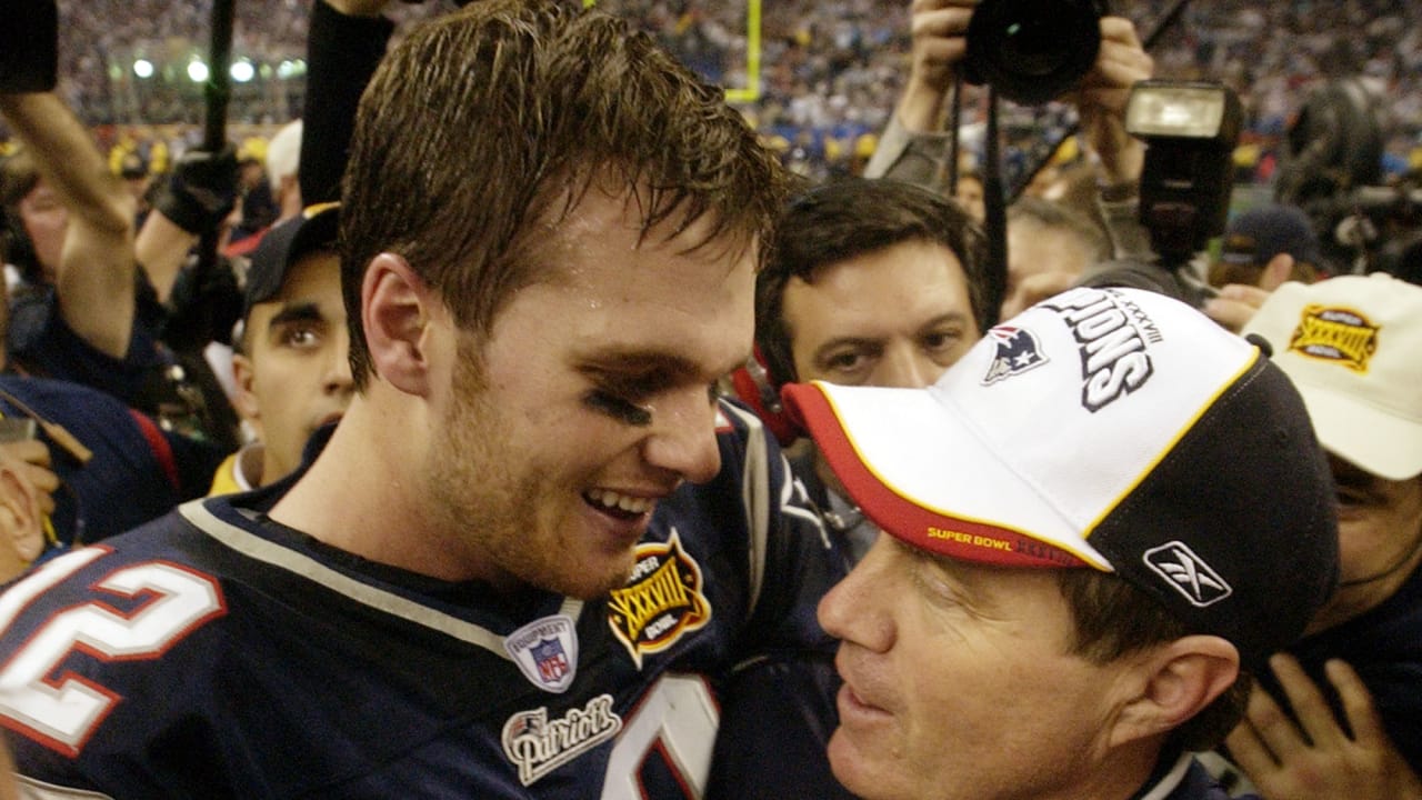 Patriot's kicker Adam Vinatieri (4) celebrates with Ken Walter (13