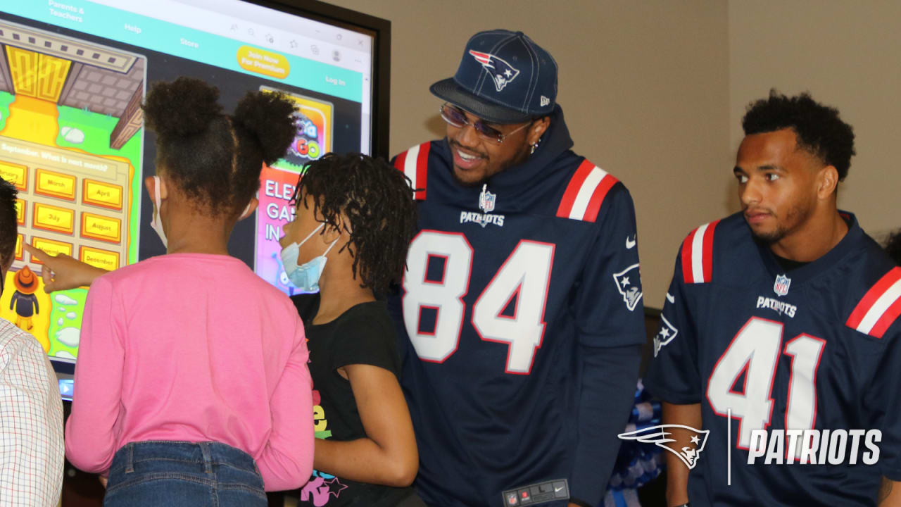 Patriots players surprise MLK School with 15 TouchView displays