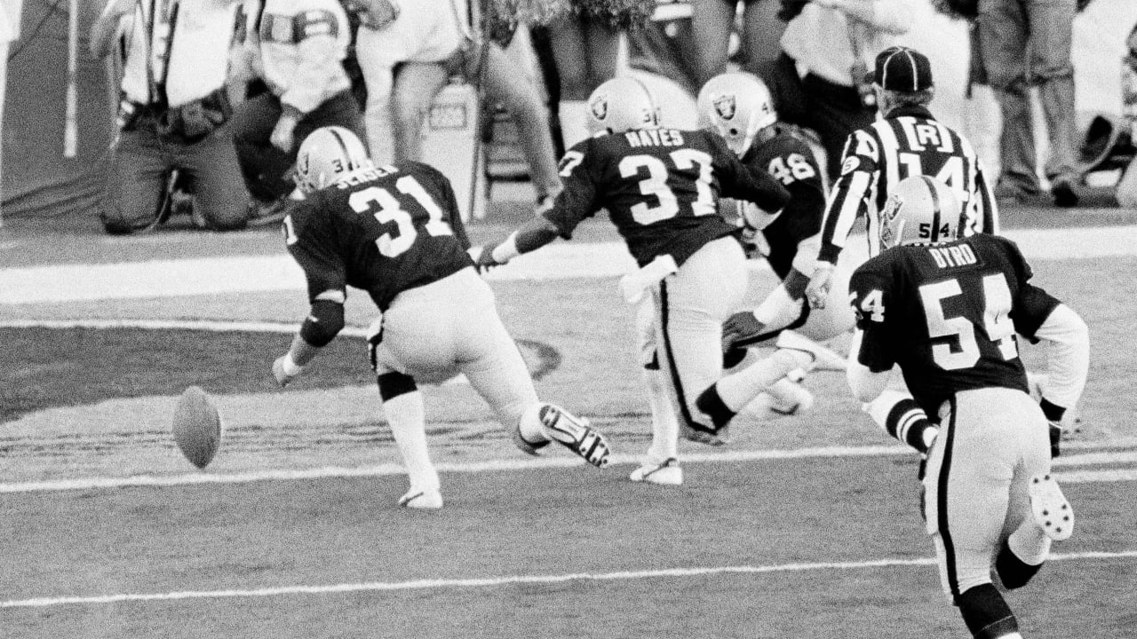 Oakland Raiders quarterback Jim Plunkett (16) prepares to throw the ball in  a game against the …