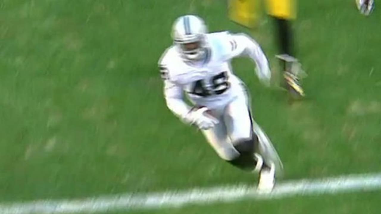 Oakland Raiders fullback Jamize Olawale powers through the line to