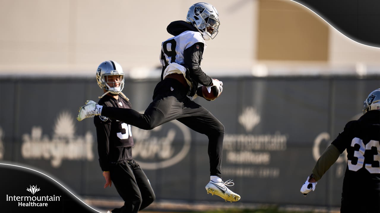 Raiders tight end Foster Moreau (87) is tackled by Raiders linebacker Javin  White (53) during a …