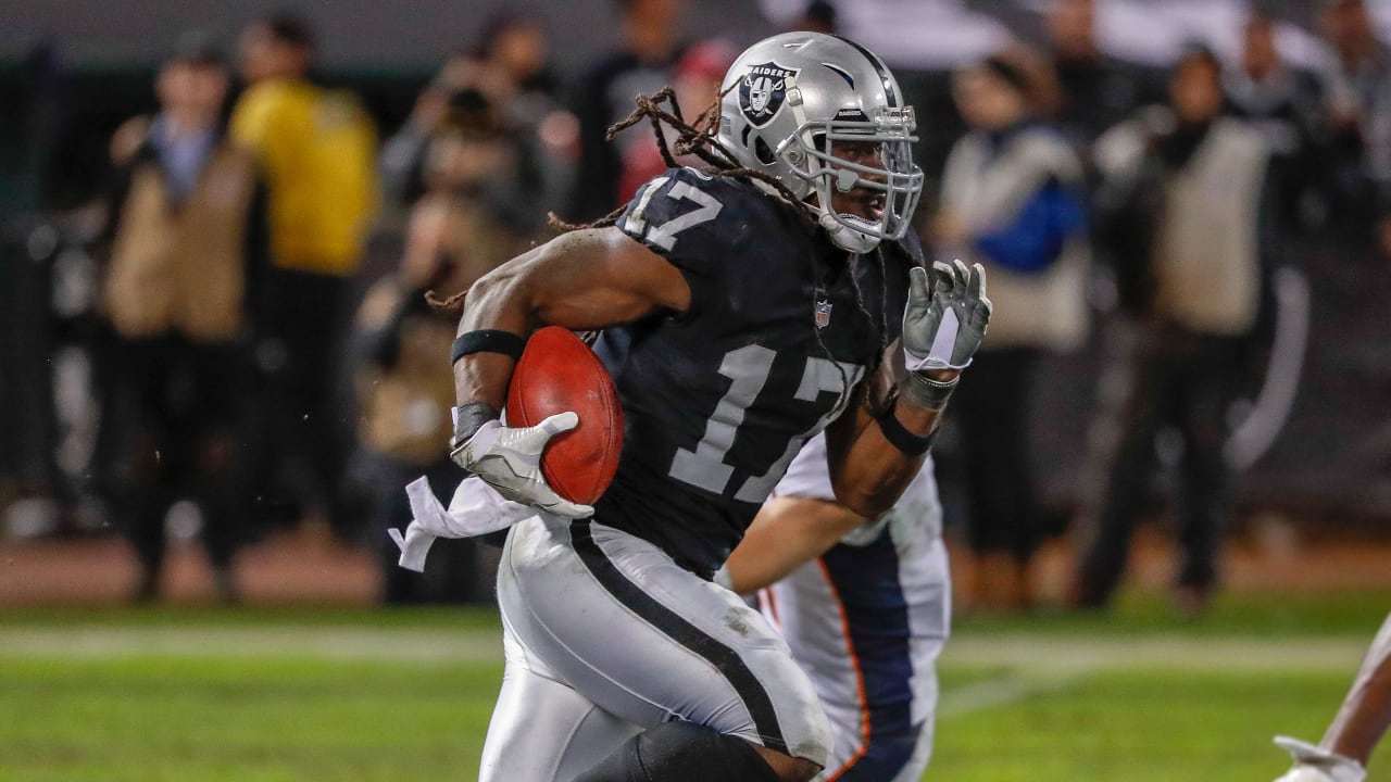 Oakland Raiders' Dwayne Harris (17) returns a punt for a touchdown against  the Denver Broncos during the first half of an NFL football game in Oakland,  Calif., Monday, Dec. 24, 2018. (AP