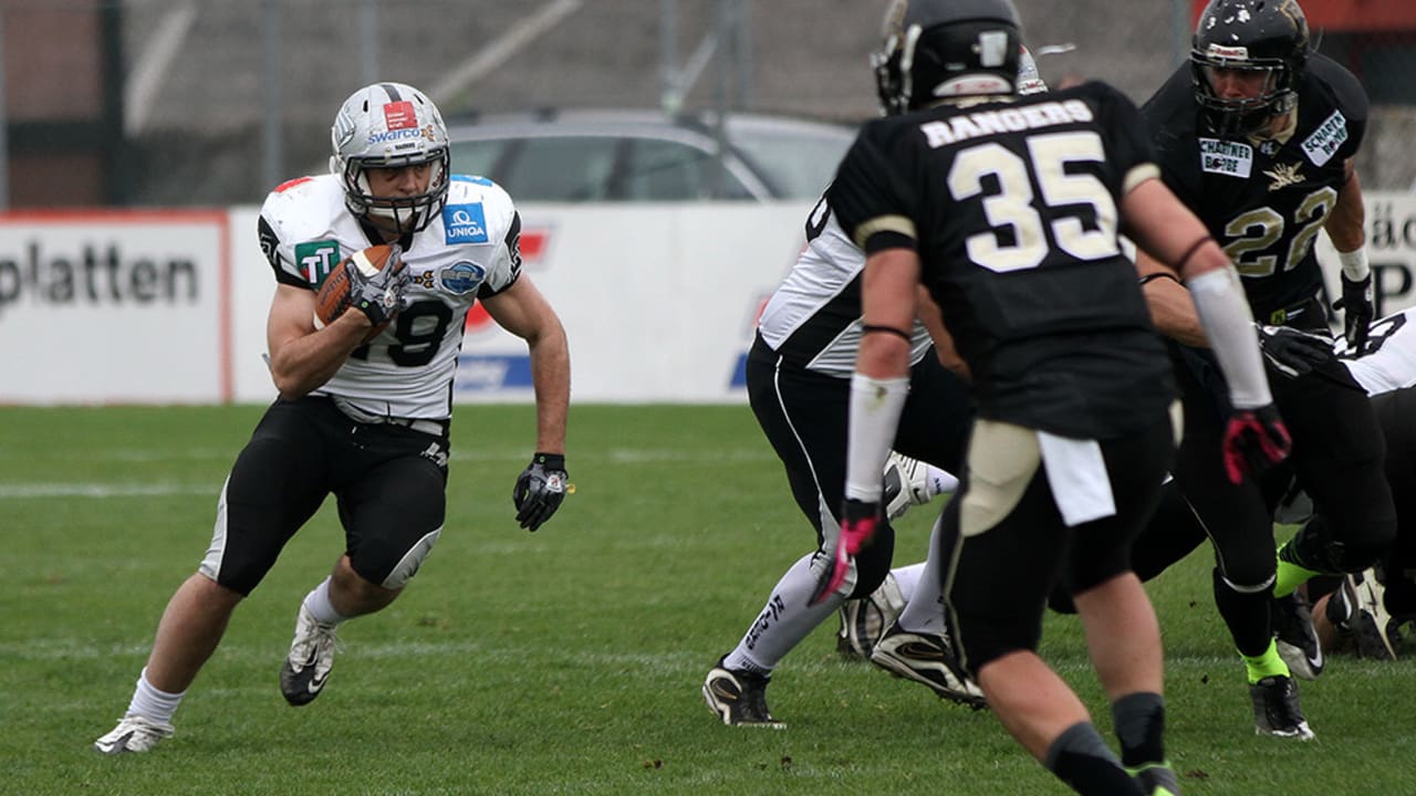 American football, WR Talib Wise, No. 4 Raiders, is tackled