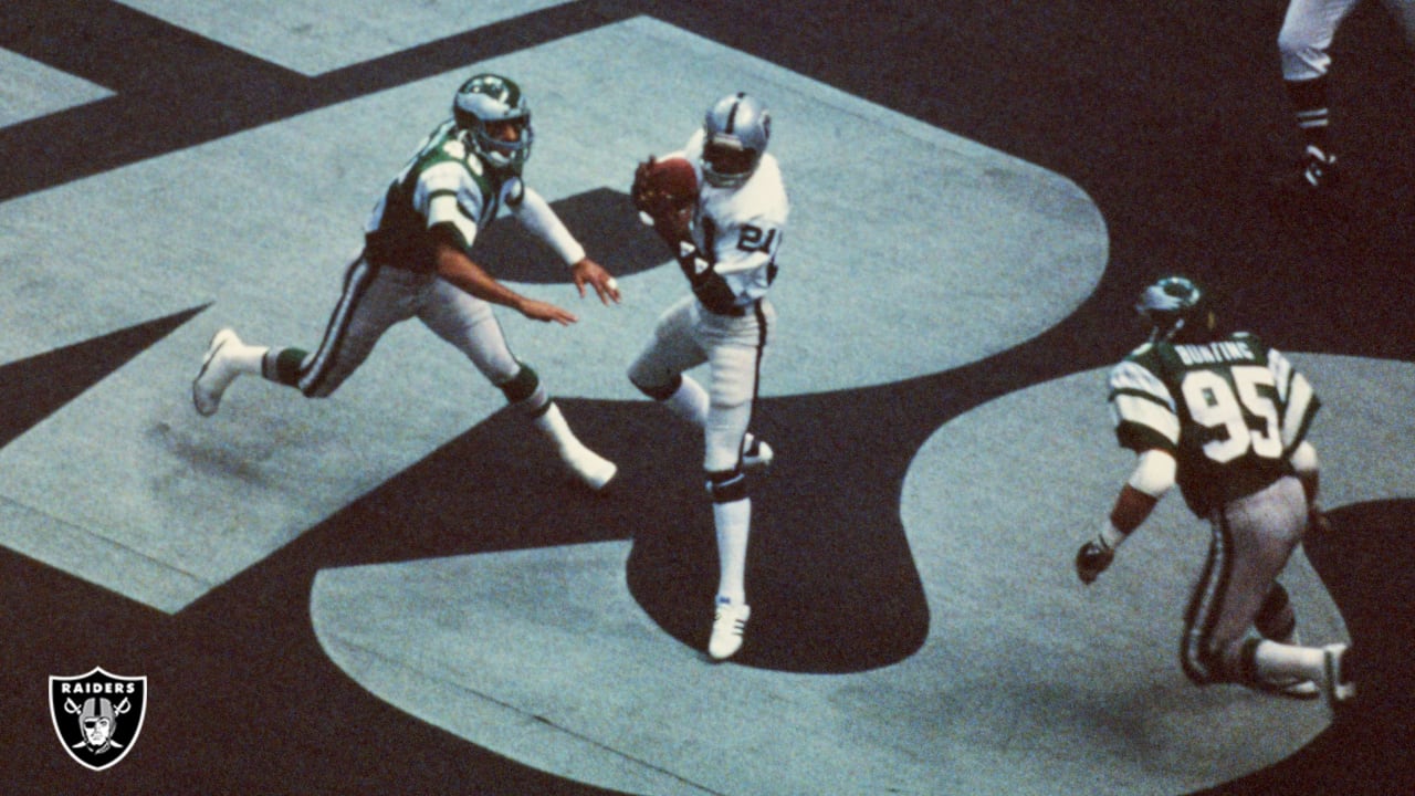 Oakland Raiders quarterback Jim Plunkett takes a snap during the playoff  game between the Cleveland Browns and the Oakland Raiders at Cleveland  Stadium on Jan. 4, 1981. Gene Upshaw is number 63