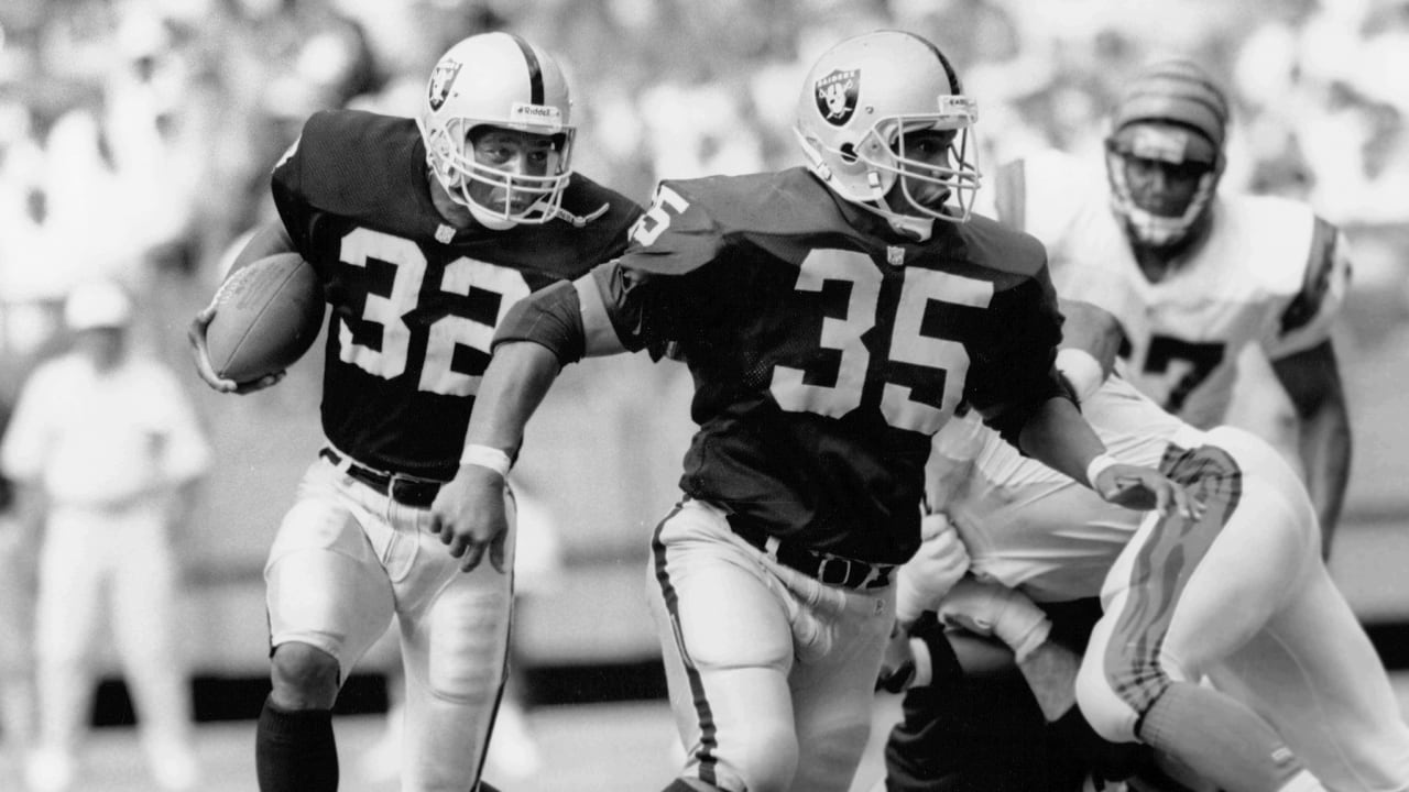 Mike Haynes #22 of the Los Angeles Raiders looks on from the bench against  the Kansas City…