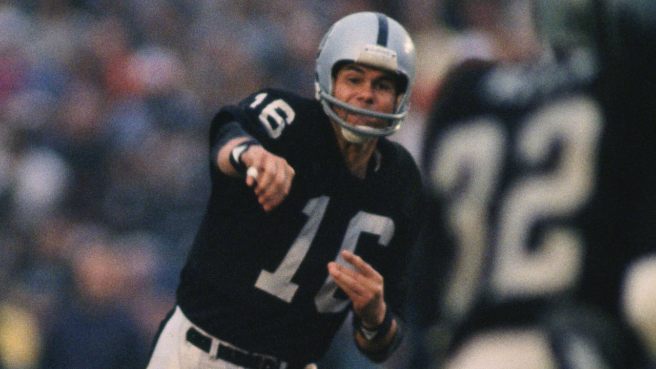 Oakland Raiders quarterback Jim Plunkett (16) prepares to throw the ball in  a game against the …