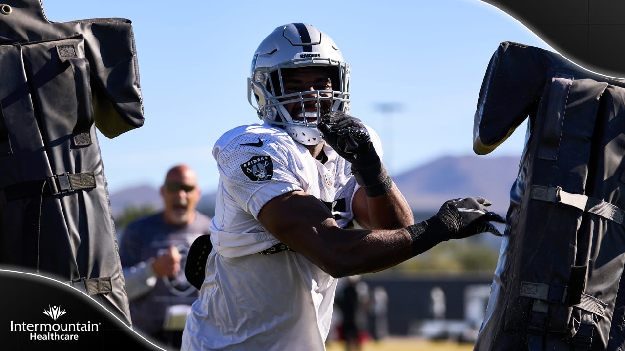 Raiders tight end Foster Moreau (87) is tackled by Raiders linebacker Javin  White (53) during a …