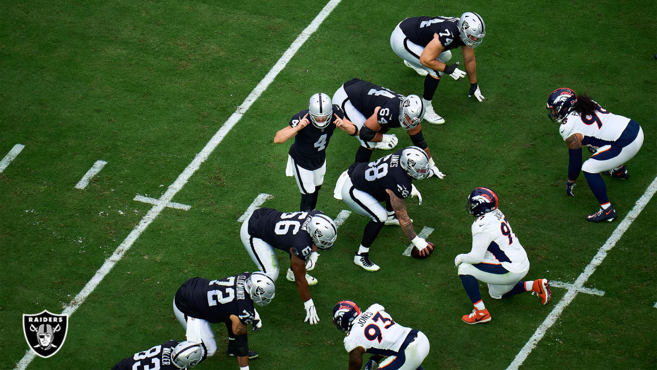 Denver Broncos vs. Las Vegas Raiders. NFL Game. American Football League  match. Silhouette of professional player celebrate touch down. Screen in  back Stock Photo - Alamy