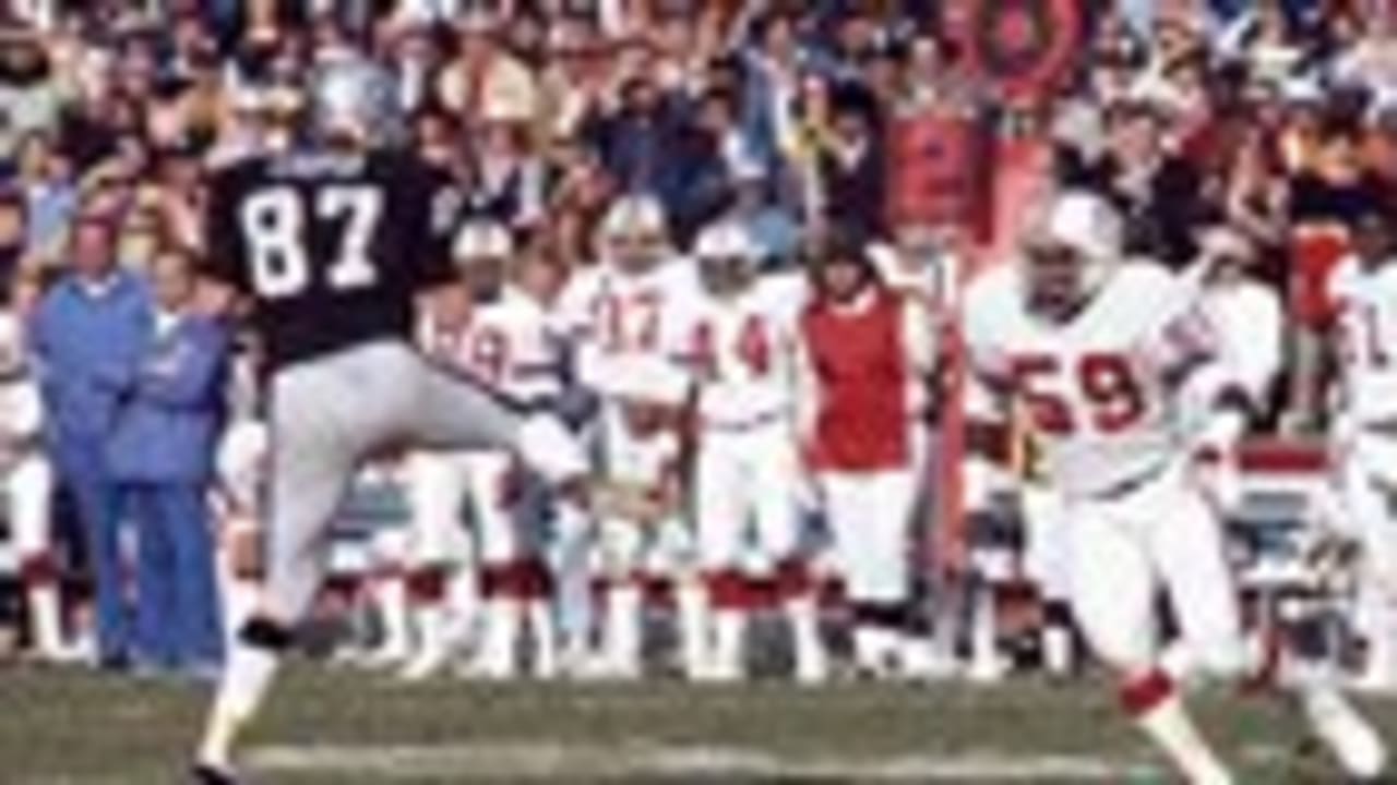 Oakland Raiders quarterback Ken Stabler (12) is caught in the act of  scoring game winning touchdown against the New England Patriots on  Saturday, Dec. 20, 1976 in Oakland. Arriving on the scene