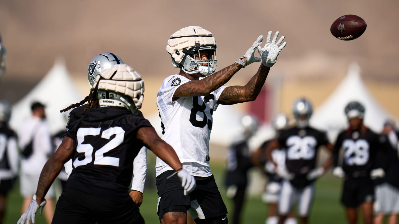 Here's why some Patriots players are wearing caps over their helmets during  training camp