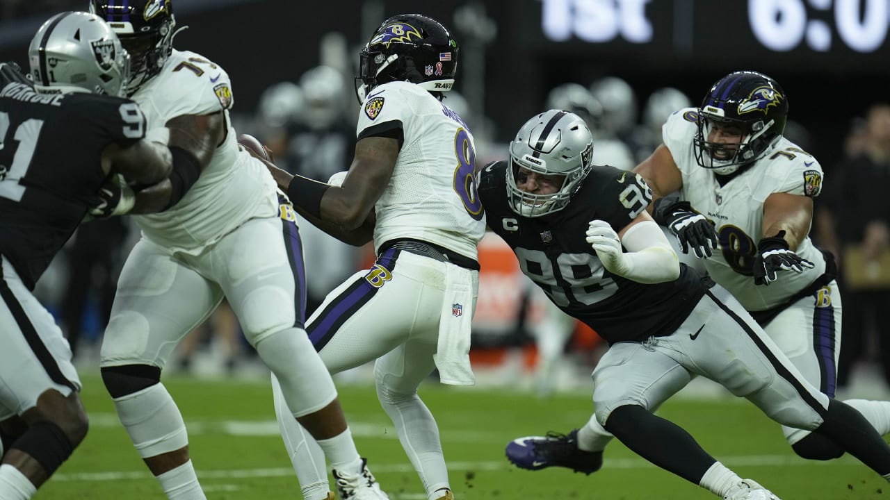 Raiders defensive end Maxx Crosby (98) sacks Baltimore Ravens