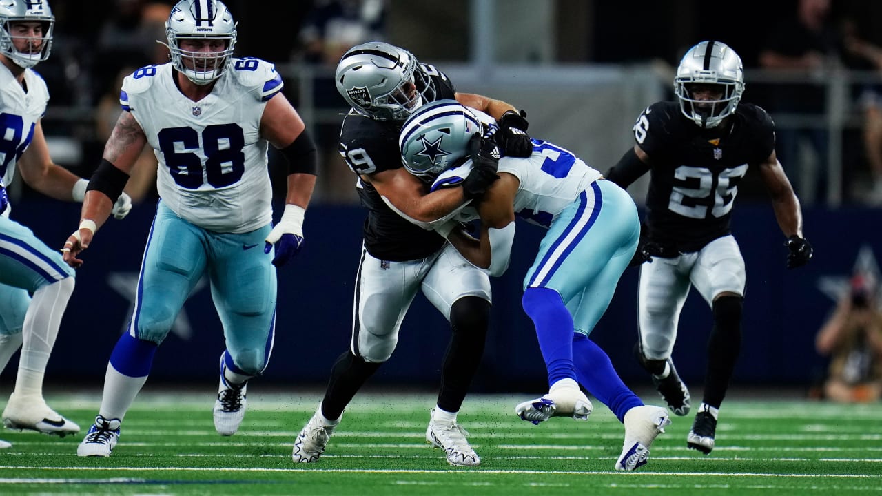 Arlington, United States. 26th Aug, 2023. Dallas Cowboys quarterback Will  Grier (15) is tackled by Las Vegas Raiders linebacker Luke Masterson (59)  during a NFL preseason season game between the Las Vegas