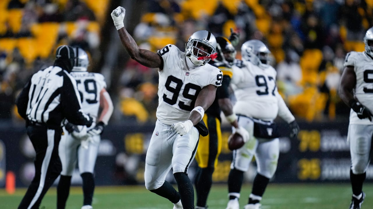 Defensive end Clelin Ferrell (99) grabs some air during a Las