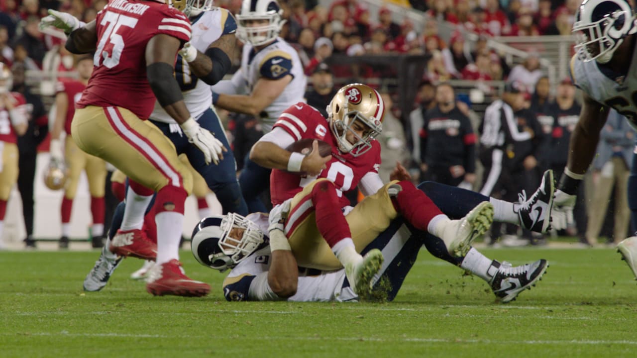 Keith Birmingham on X: Quarterback Jimmy Garoppolo #10 of the San  Francisco 49ers throws an interception under pressure from defensive end  Aaron Donald #99 of the Los Angeles Rams in the fourth