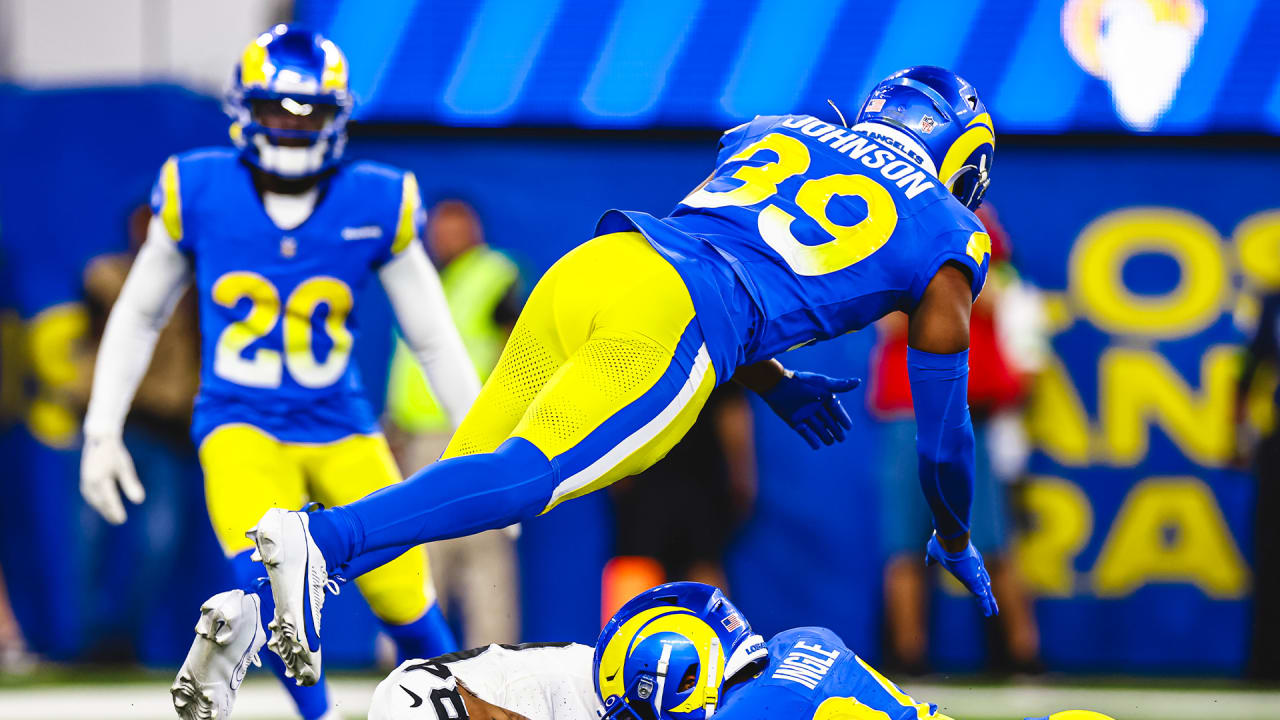 Los Angeles Rams defensive back Jordan Fuller forces a turnover by ripping  the ball away from Colts quarterback Anthony Richardson