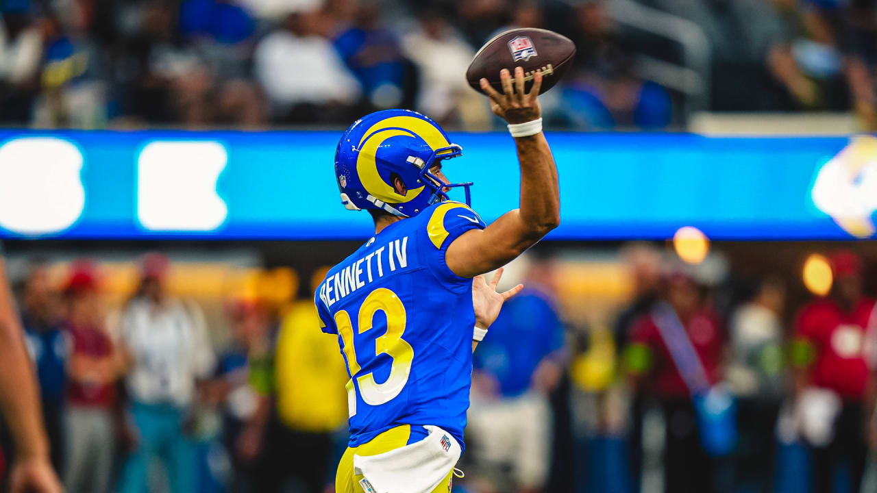 Los Angeles Rams quarterback Stetson Bennett (13) is sacked by Los