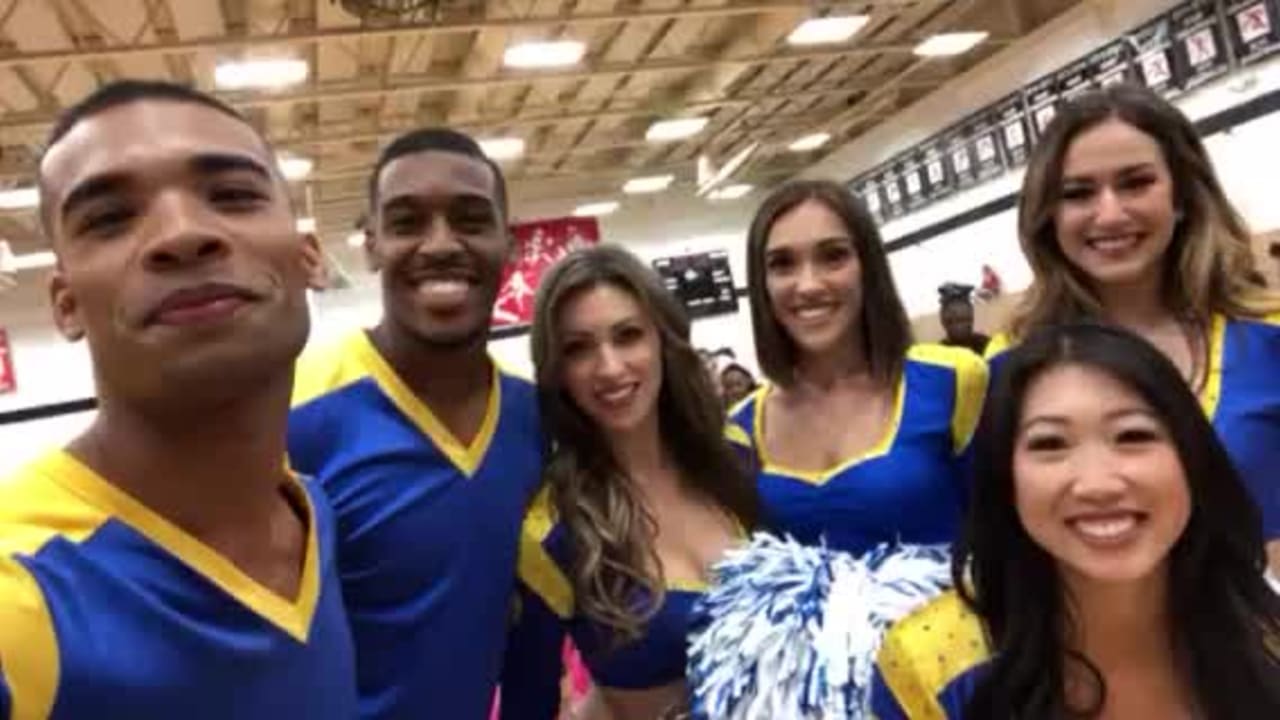 LA Rams safety John Johnson and cheerleaders hit the field with Hawaii youth